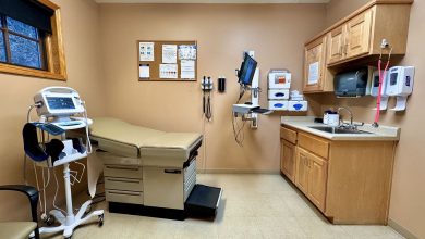 doctor listening to a patient during a clinic checkup