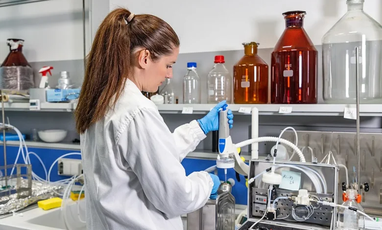 Scientists working in a water analysis laboratory with sample bottles