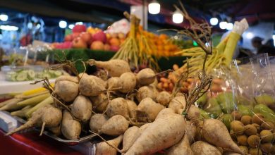 A farmers market stall with vegetables