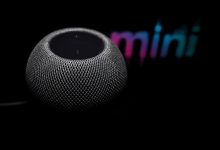 A smart speaker on a table in a living room