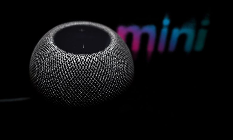 A smart speaker on a table in a living room